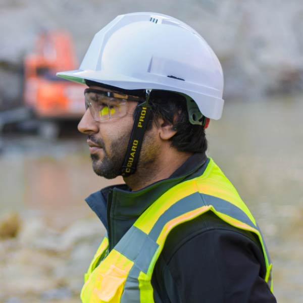 Construction worker Mark Williams wearing safety helmet and glasses - Supply Chain Transparency
