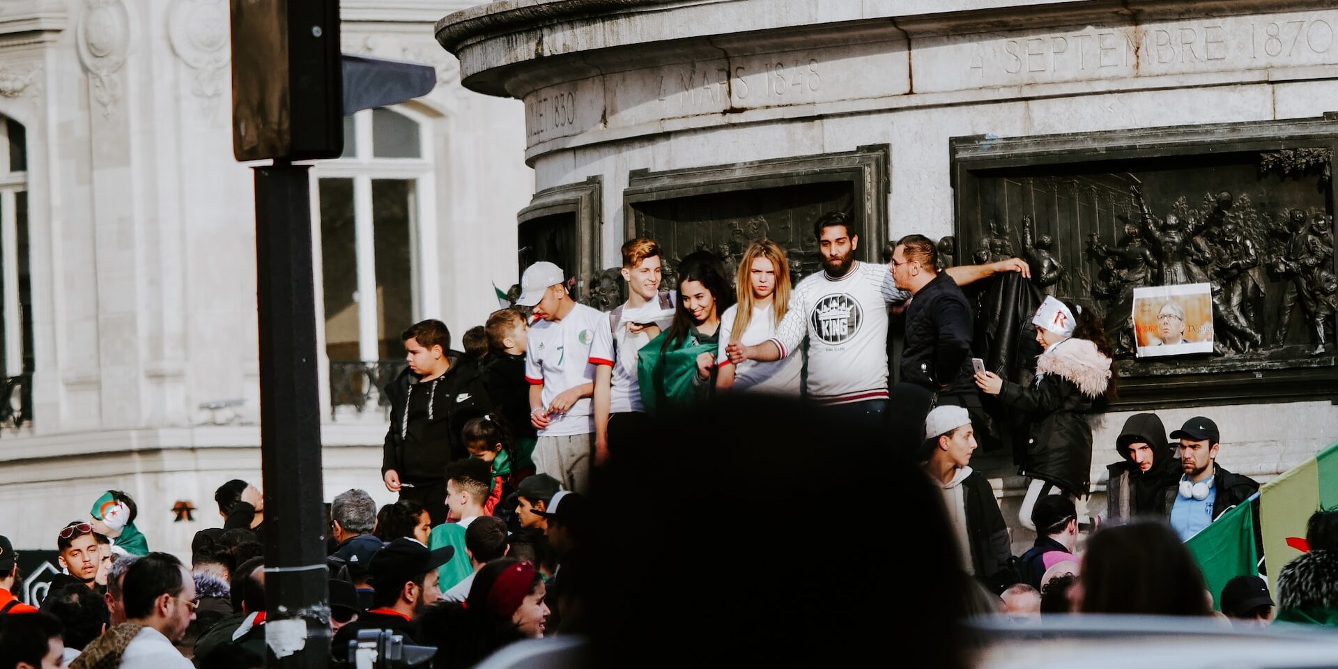 Regulatory Landscape: Government Initiatives to Enhance Supply Chain Transparency Crowd of people protesting near a historical monument. Government initiatives impacting supply chain transparency. - Supply Chain Transparency