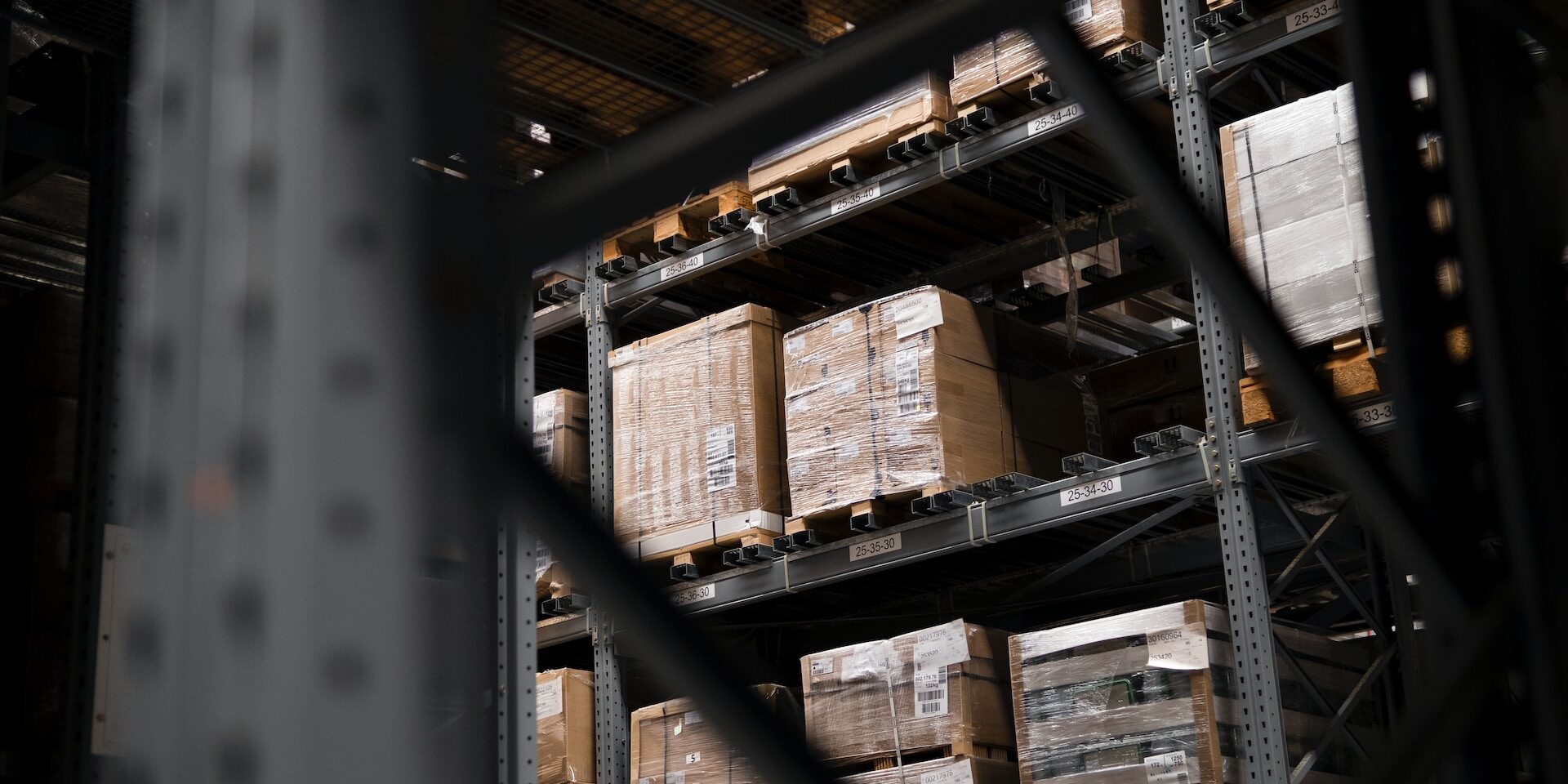 Vendor Fraud: Protecting Supply Chains from Dishonest Suppliers Warehouse inventory stacked on pallets, showing potential for vendor fraud. - Supply Chain Transparency