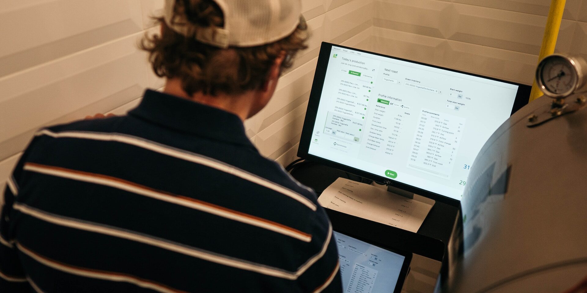 The Role of Predictive Analytics in Demand Forecasting Person reviewing data on computer screens showing predictive analytics for demand forecasting. - Supply Chain Transparency