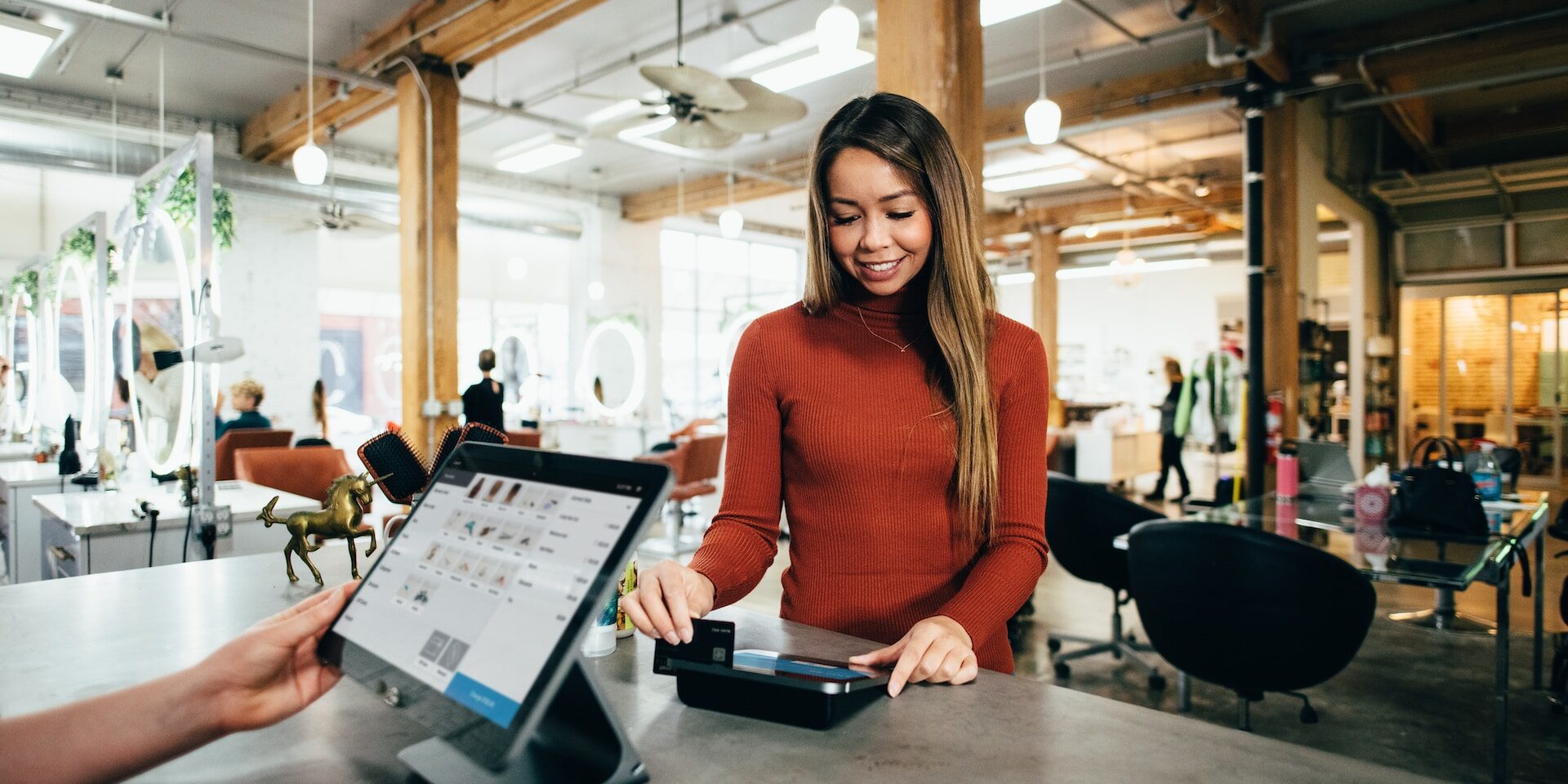 The Rise of Omni-Channel Supply Chains in Retail Woman using contactless payment at a retail checkout. Omni-channel retail. - Supply Chain Transparency