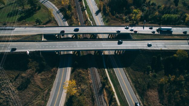 Sustainable Supply Chains: Strategies for Environmental Responsibility Aerial view of highway interchange, showcasing efficient transportation infrastructure. - Supply Chain Transparency