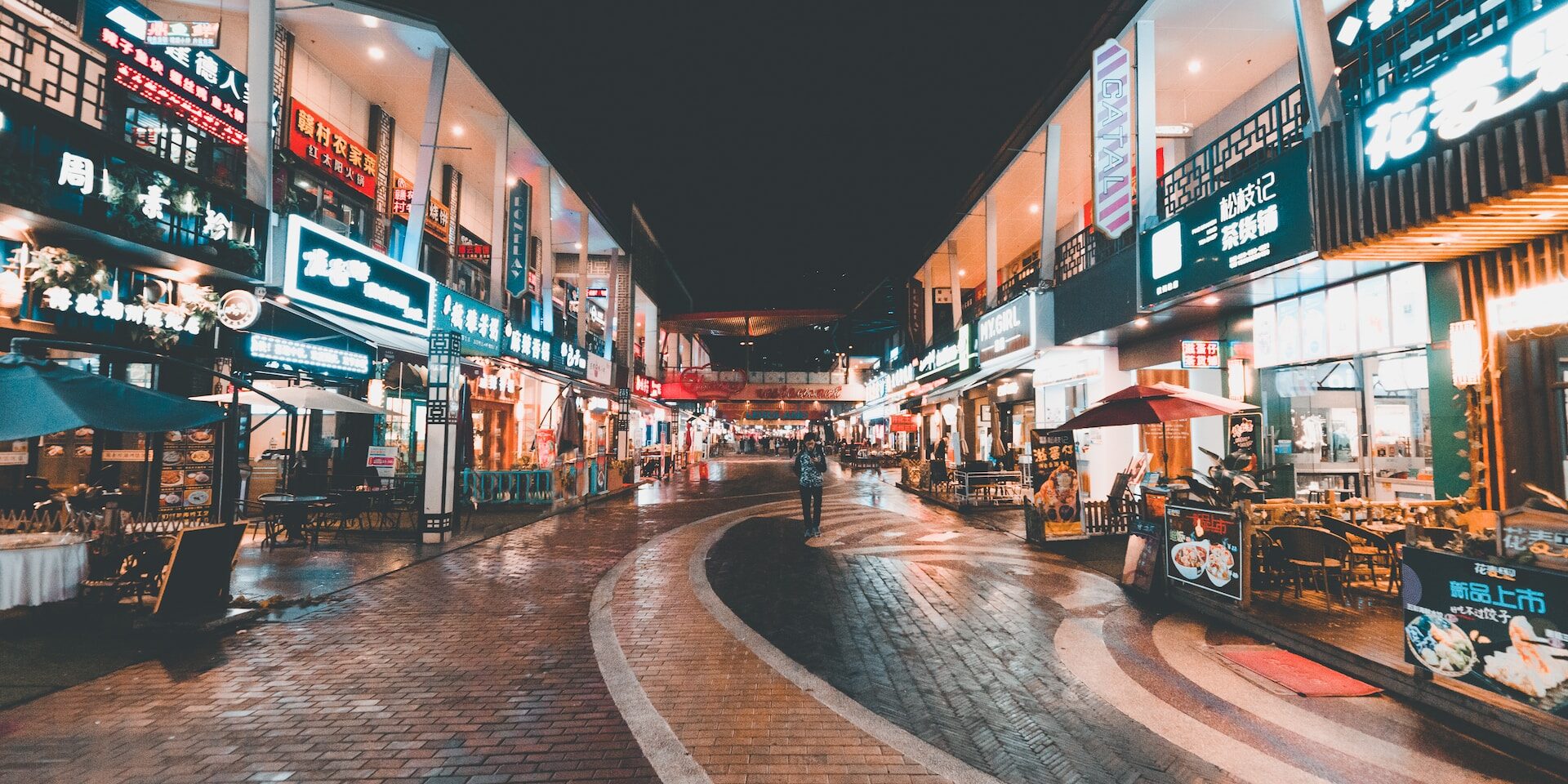 Night market in China, showcasing bustling street food stalls and shops. International trade benefits economies. - Supply Chain Transparency