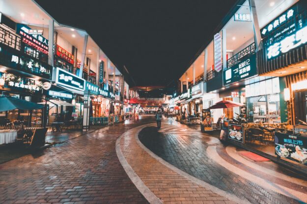 The Benefits of International Trade: Advantages for Economies and Businesses Night market in China, showcasing bustling street food stalls and shops. International trade benefits economies. - Supply Chain Transparency