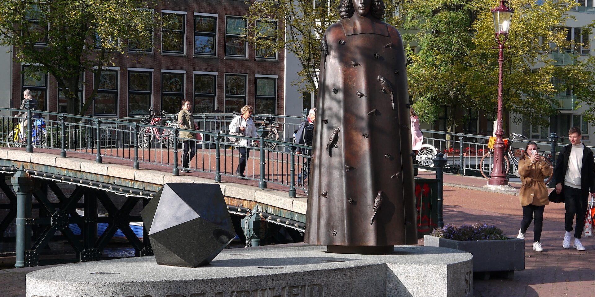 Global Trade Trends in International Trade: Examining Patterns and Shifts Bronze statue of Spinoza in Amsterdam, with "Staat is de Vrijheid" inscribed below. - Supply Chain Transparency
