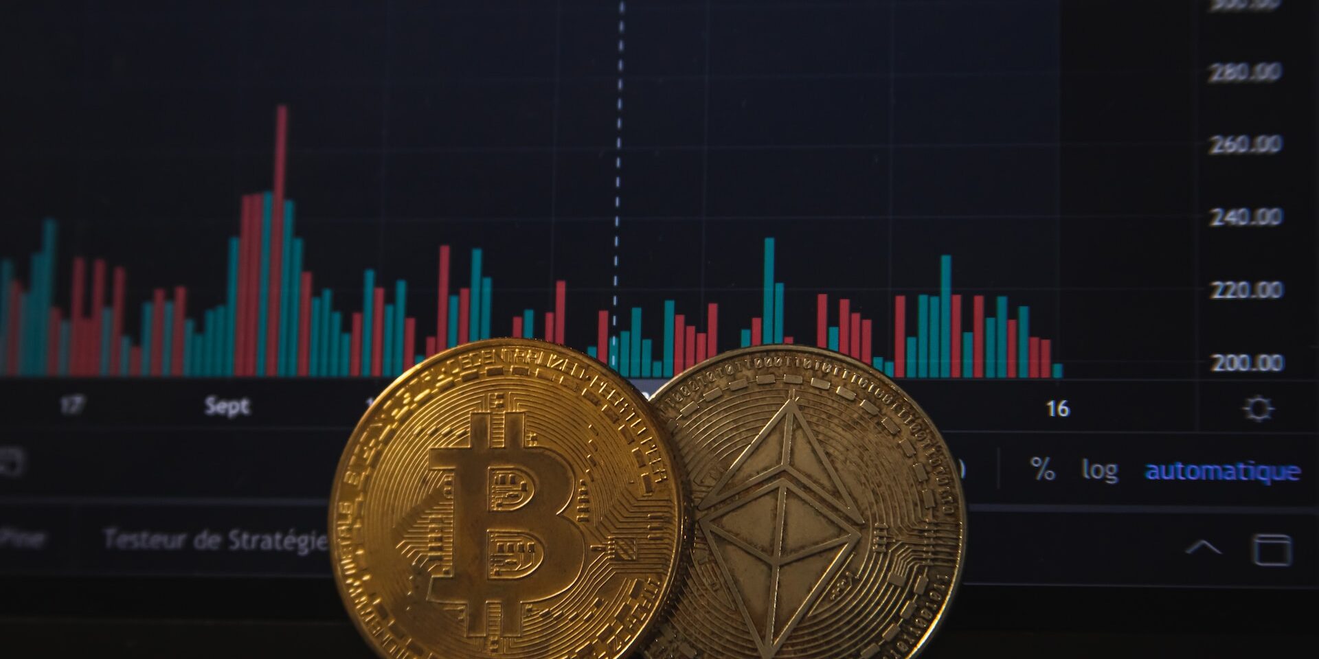 The Rise of Blockchain in Supply Chain Management Bitcoin and Ethereum cryptocurrency coins on a laptop displaying a blockchain price chart. Illustrating blockchain's use in supply chain management. - Supply Chain Transparency