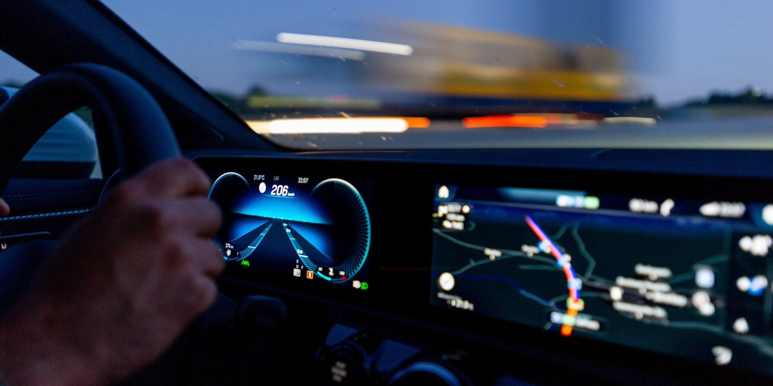 The Future of Autonomous Vehicles in Supply Chain Operations Driver's view of digital dashboard showing 206 km/h speed and navigation map. Autonomous vehicle technology. - Supply Chain Transparency