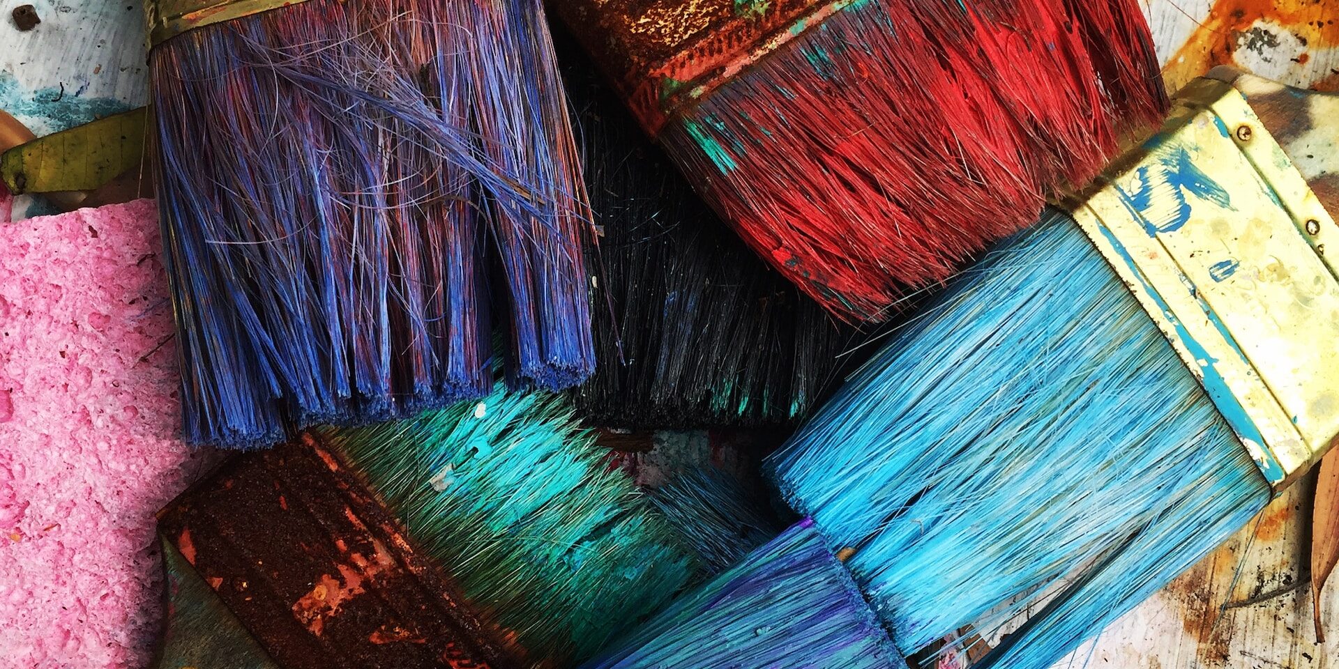 Blockchain Technology: Enhancing Transparency and Reducing Fraud in Supply Chains Close-up of paintbrushes with various colors of paint. - Supply Chain Transparency