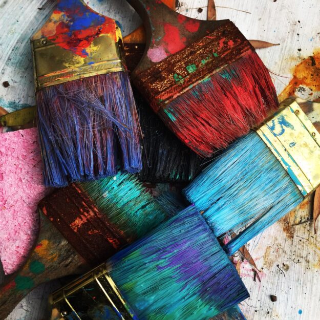 Blockchain Technology: Enhancing Transparency and Reducing Fraud in Supply Chains Close-up of paintbrushes with various colors of paint. - Supply Chain Transparency