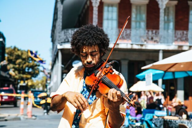 Supply Chain Network Design: Optimizing Efficiency and Performance Street musician playing violin in New Orleans. - Supply Chain Transparency