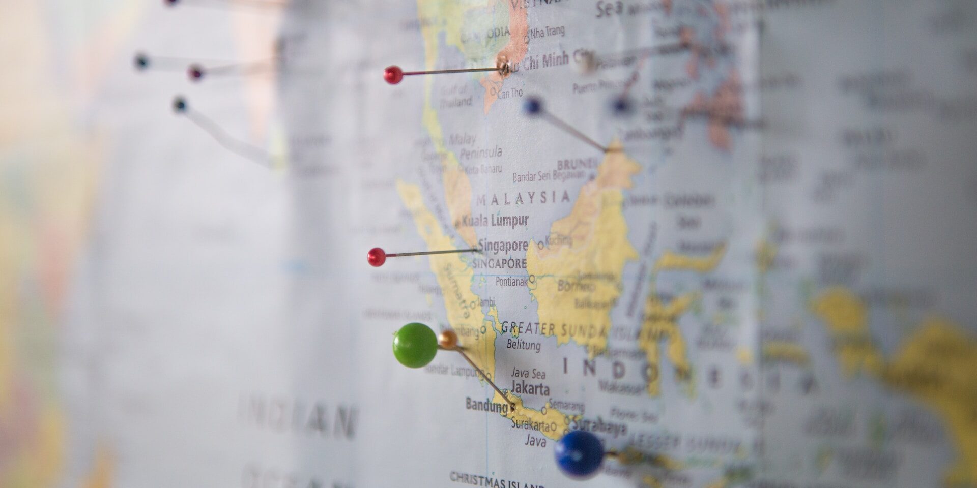 Uncovering Supply Chain Fraud: Types, Causes, and Impacts Pushpins mark locations on a world map, highlighting global supply chains vulnerable to fraud. - Supply Chain Transparency