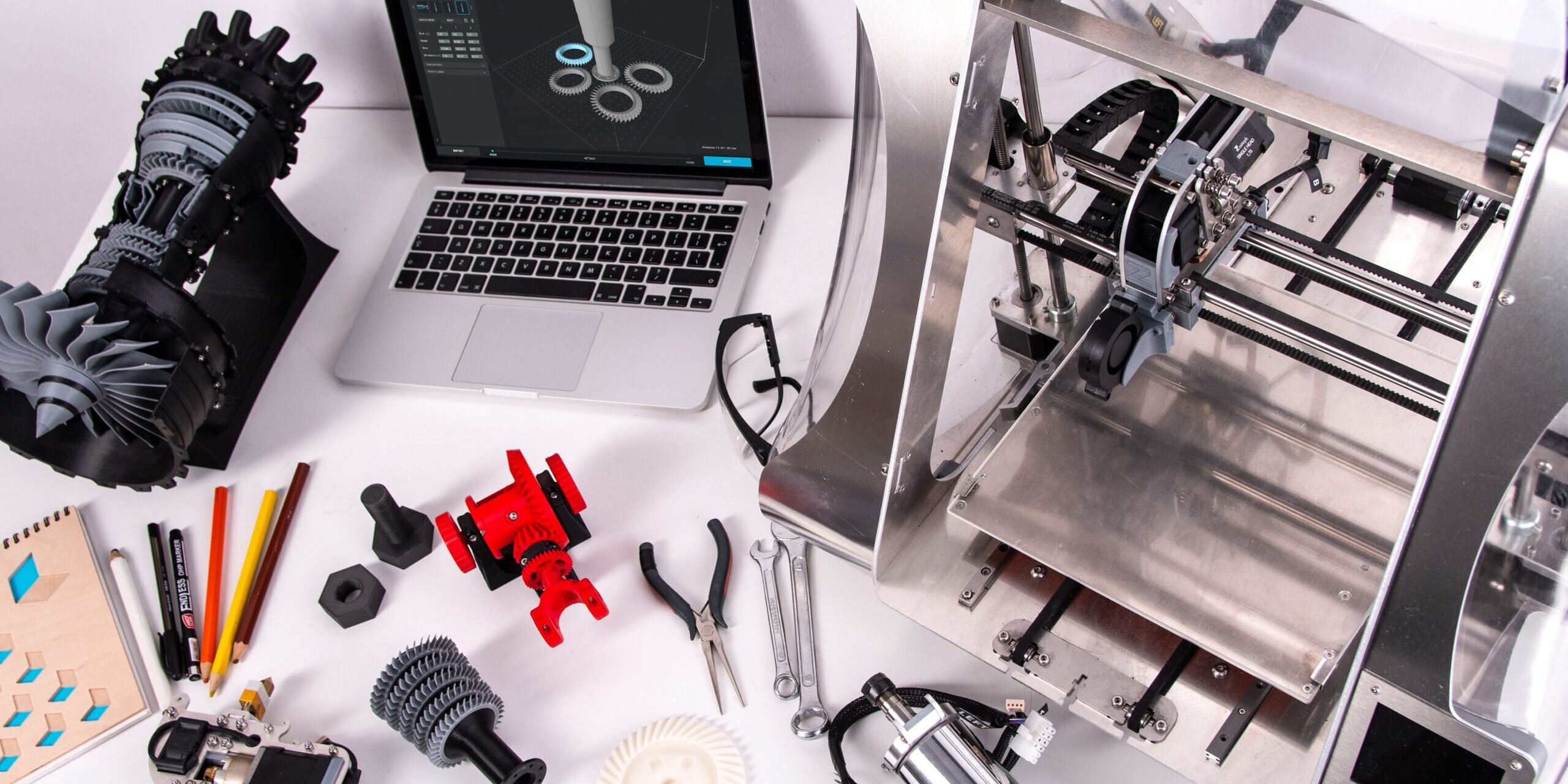 The Role of Automation and Robotics in Modern Supply Chains 3D printer, laptop, and 3D printed parts; illustrating automation in modern supply chains. - Supply Chain Transparency