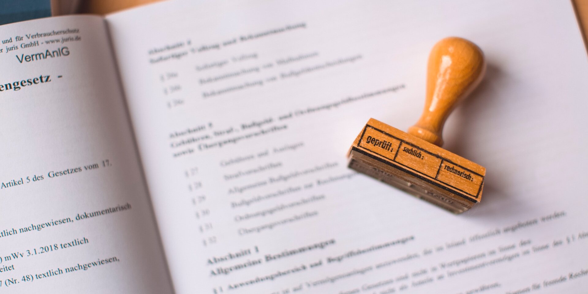 The Influence of Trade Policies on Supply Chain Decisions Wooden stamp on legal document; "geprüft" (verified) is visible. - Supply Chain Transparency